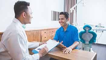 patient talking to dentist about financial options 