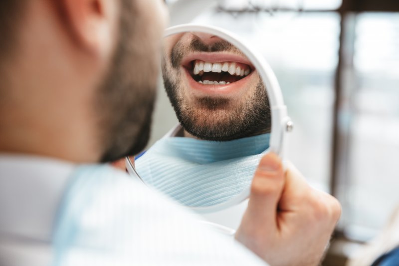 Patient talking to dentist about dental crowns and fillings