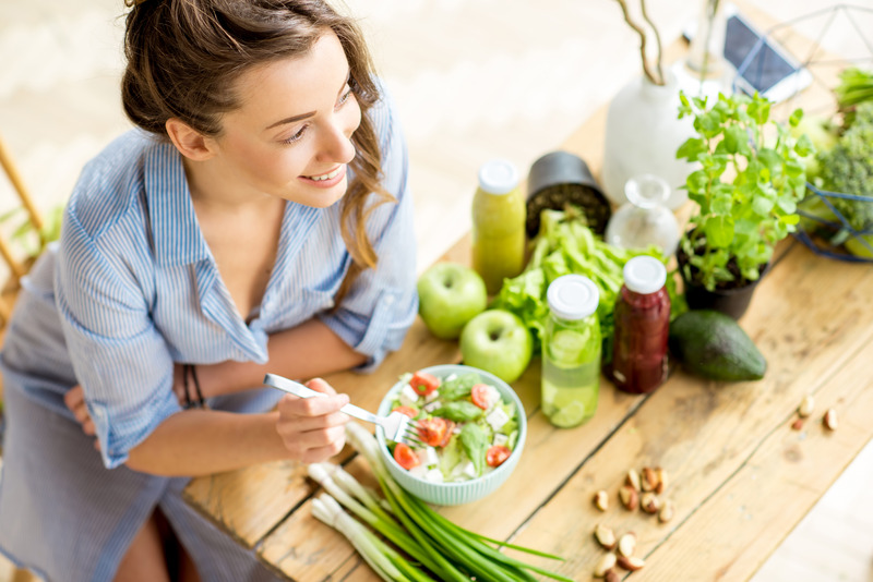 Patient eating food for gum disease protection